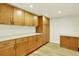Spacious storage area with ample wooden cabinetry and countertop space at 7895 W 67Th Ave, Arvada, CO 80004