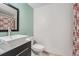 Modern bathroom featuring a stylish vessel sink and neutral decor at 10440 W 83Rd Ave, Arvada, CO 80005