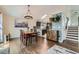 Open-concept dining area with a view of the kitchen at 10440 W 83Rd Ave, Arvada, CO 80005