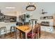 Stylish dining area connecting the kitchen and living room at 10440 W 83Rd Ave, Arvada, CO 80005