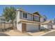 Charming home featuring a two-car garage, beautiful brick accents, and tasteful siding at 10440 W 83Rd Ave, Arvada, CO 80005