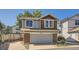 Charming home featuring a two-car garage, beautiful brick accents, and tasteful siding at 10440 W 83Rd Ave, Arvada, CO 80005
