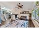 Comfortable living room featuring a fireplace and stylish decor at 10440 W 83Rd Ave, Arvada, CO 80005