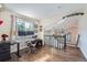 Bright home office with hardwood floors, a large window, modern desk, and comfortable chair at 10440 W 83Rd Ave, Arvada, CO 80005