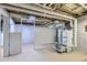 Unfinished basement with painted walls, exposed pipes, and mechanical equipment at 2541 Bellaire St, Denver, CO 80207