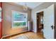 Bedroom with hardwood floors, a radiator, and large windows at 2541 Bellaire St, Denver, CO 80207