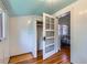 View of the bedroom from the closet with wood floors and ample natural light at 2541 Bellaire St, Denver, CO 80207