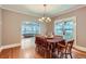 Traditional dining room boasts hardwood floors and ample natural light from adjacent rooms at 2541 Bellaire St, Denver, CO 80207