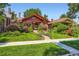 Charming home with a well-manicured front yard and vibrant landscaping at 2541 Bellaire St, Denver, CO 80207
