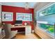 Bright home office with built-in shelves, large windows, and modern decor at 2541 Bellaire St, Denver, CO 80207