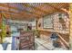 Charming brick patio with a wood pergola, seating area, and decorative accents for outdoor living at 2541 Bellaire St, Denver, CO 80207