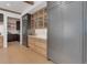 Gourmet kitchen with custom cabinets, stainless steel appliances, and a view into the open floorplan at 352 S High St, Denver, CO 80209