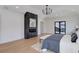 Serene main bedroom featuring a modern fireplace, private balcony, and plenty of natural light at 352 S High St, Denver, CO 80209