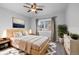 Bedroom with a large window, ceiling fan, and neutral decor at 140 Sugar Plum Way, Castle Rock, CO 80104