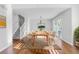 Bright dining area with hardwood floors and a modern light fixture at 140 Sugar Plum Way, Castle Rock, CO 80104