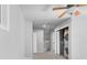 Hallway with a stacked washer and dryer unit concealed behind a sliding door and light gray walls at 140 Sugar Plum Way, Castle Rock, CO 80104