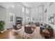 Bright living room featuring soaring ceilings, fireplace and large windows with natural light at 140 Sugar Plum Way, Castle Rock, CO 80104