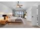 Spacious main bedroom features a ceiling fan, a bay window, and neutral décor at 140 Sugar Plum Way, Castle Rock, CO 80104