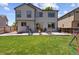 Spacious backyard with patio seating, perfect for entertaining or relaxing outdoors at 16581 Buckthorn Ln, Parker, CO 80134