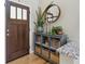 Stylish entryway with a console table, mirror, and decorative plants at 16581 Buckthorn Ln, Parker, CO 80134