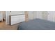 Bedroom with a modern dresser, plush carpet, and easy access to the en suite bathroom at 16581 Buckthorn Ln, Parker, CO 80134