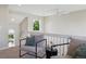 Relaxing sitting area with comfortable seating and soft, natural light streaming in at 16581 Buckthorn Ln, Parker, CO 80134