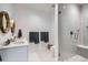 Stylish bathroom with double vanity, modern lighting, and a glass-enclosed shower at 6102 S Aberdeen St, Littleton, CO 80120