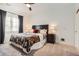 Bedroom with neutral carpet, ceiling fan, and large window at 6102 S Aberdeen St, Littleton, CO 80120