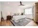 Serene bedroom with hardwood floors, neutral decor, and a comfortable king-size bed at 6102 S Aberdeen St, Littleton, CO 80120