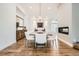 Elegant dining room with modern light fixture, fireplace, and ample seating, perfect for hosting gatherings and creating memories at 6102 S Aberdeen St, Littleton, CO 80120
