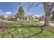 Beautiful home featuring well-manicured lawn, attractive landscaping, and an inviting front porch perfect for relaxation at 6102 S Aberdeen St, Littleton, CO 80120