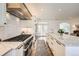 Bright, spacious kitchen boasts a large island, modern appliances, and plenty of counter space at 6102 S Aberdeen St, Littleton, CO 80120