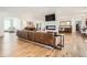Expansive living room with wood floors, modern fireplace, and comfortable leather sofa at 6102 S Aberdeen St, Littleton, CO 80120