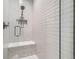 Modern shower with white subway tile and glass door at 6102 S Aberdeen St, Littleton, CO 80120