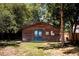 View of the backyard with a small lawn and a wood house at 1878 S Gilpin St, Denver, CO 80210