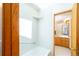This bathroom has a nice tub, tiled walls and a wood cabinet with a white top at 1878 S Gilpin St, Denver, CO 80210