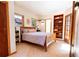 Cozy bedroom with wood floors, built-in shelves, and sunny windows at 1878 S Gilpin St, Denver, CO 80210