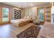 This bedroom has a sitting area and a view to the backyard through two windows and a door at 1878 S Gilpin St, Denver, CO 80210