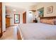 Bedroom with wood floors, built-in shelves, and lots of natural light at 1878 S Gilpin St, Denver, CO 80210
