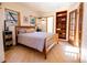 Cozy bedroom with wood floors, built-in shelves, and sunny windows at 1878 S Gilpin St, Denver, CO 80210
