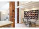 Charming dining area with a unique brick accent, a modern table set, and a cozy atmosphere at 1878 S Gilpin St, Denver, CO 80210