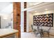 Charming dining area with a unique brick accent, a modern table set, and a cozy atmosphere at 1878 S Gilpin St, Denver, CO 80210