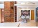 Charming dining area with a unique brick accent, a modern table set, and a cozy atmosphere at 1878 S Gilpin St, Denver, CO 80210