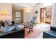 Cozy living room featuring a comfortable seating arrangement, a skylight, and stylish decor at 1878 S Gilpin St, Denver, CO 80210