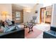 Cozy living room featuring a comfortable seating arrangement, a skylight, and stylish decor at 1878 S Gilpin St, Denver, CO 80210