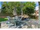 Outdoor deck with dining and seating areas, ideal for enjoying the peaceful backyard setting at 20922 E Crestline Cir, Centennial, CO 80015