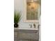 Bathroom vanity featuring double sinks, framed mirror and granite countertop at 20922 E Crestline Cir, Centennial, CO 80015