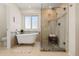 Bathroom featuring glass shower, claw footed tub, and large window at 20922 E Crestline Cir, Centennial, CO 80015