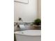 Close-up of tub with waterfall faucet and decorative accent tiles at 20922 E Crestline Cir, Centennial, CO 80015