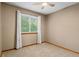 Neutral bedroom with soft carpet, a bright window providing ample natural light at 20922 E Crestline Cir, Centennial, CO 80015